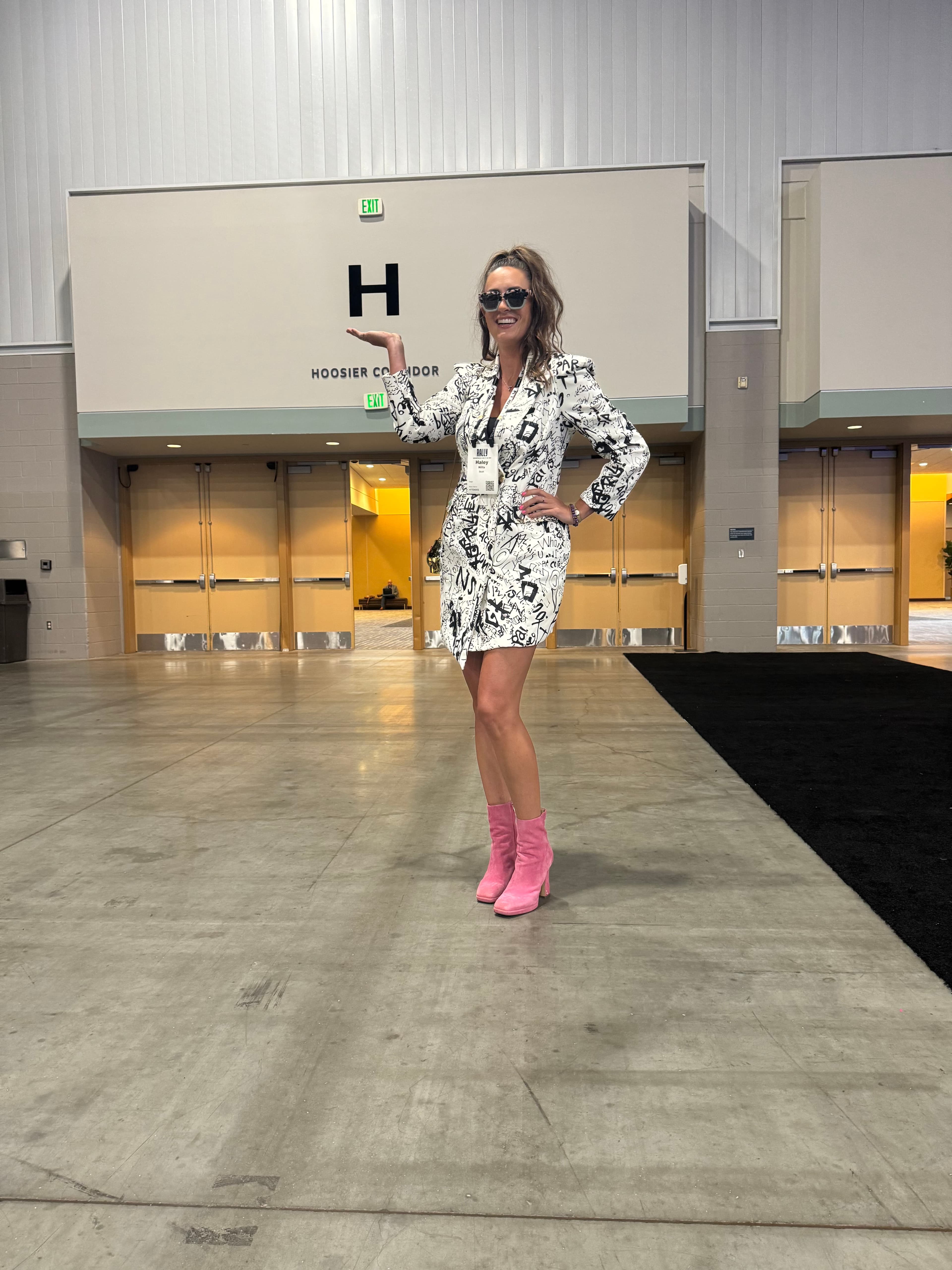 Haley out in Indianapolis, pink boots, ready to host.