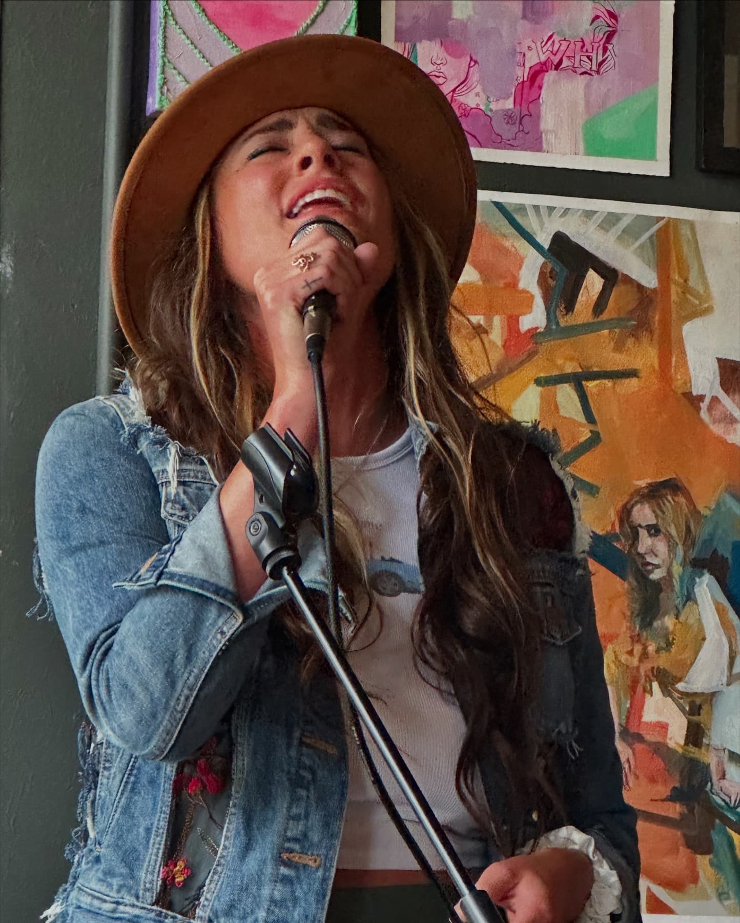 Haley at the mic under deep red light.
