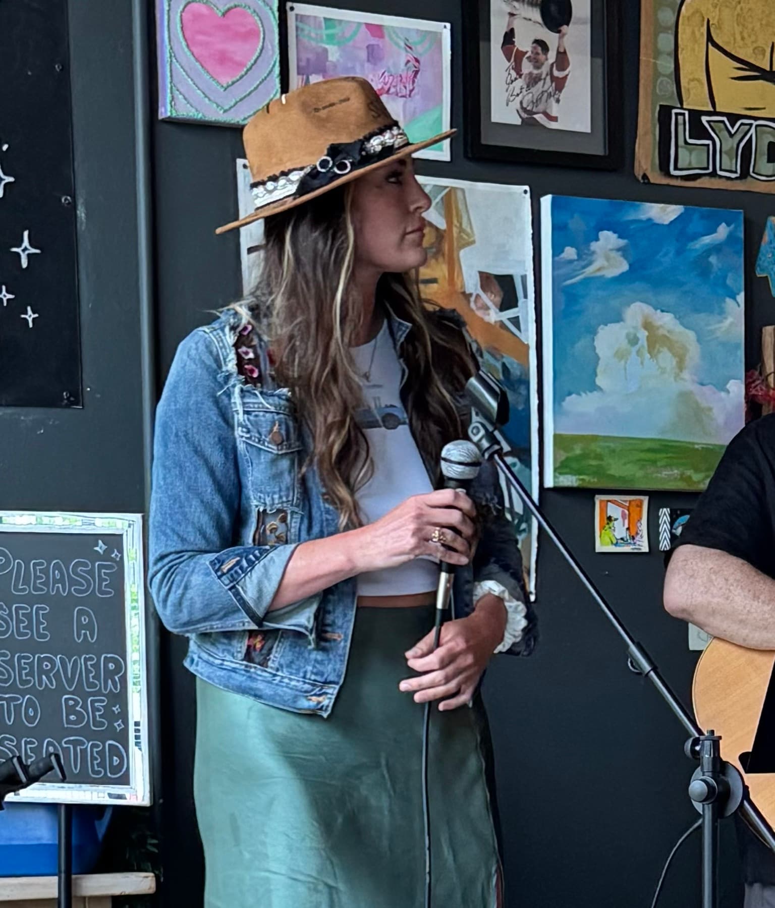 Haley playing and singing live.