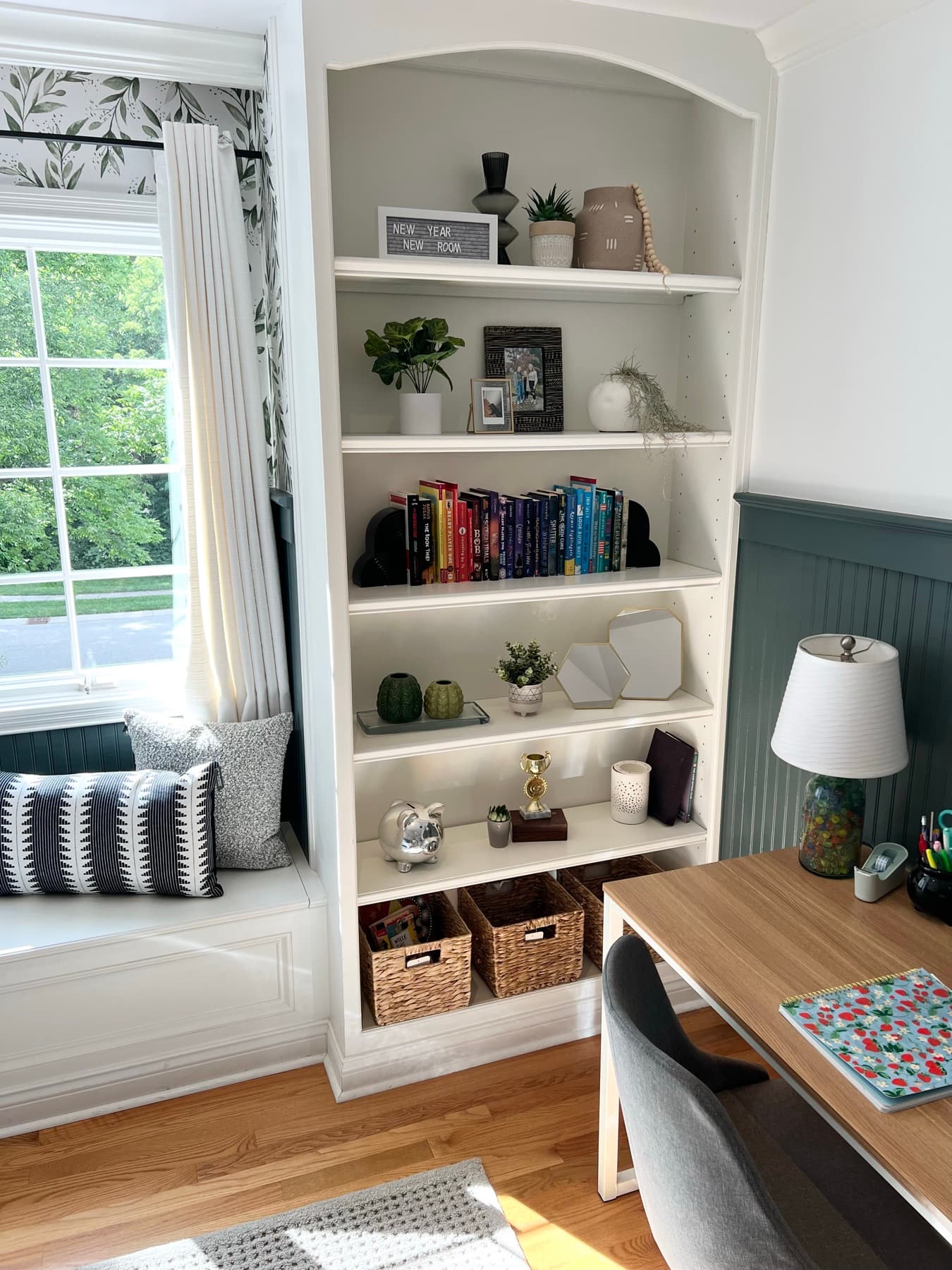 Built-in shelving framing the window seat.