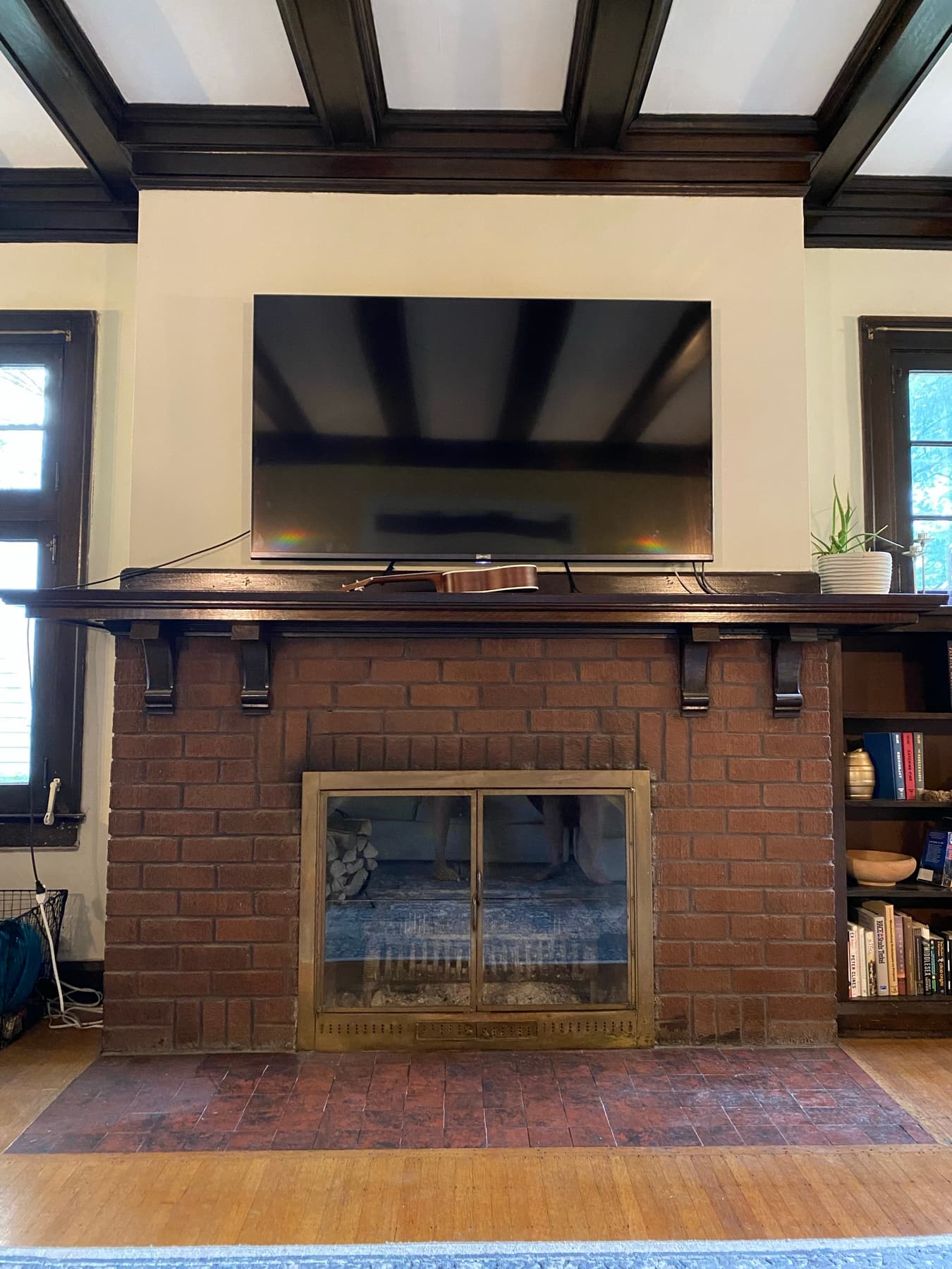 Before, a dark, dated brick fireplace with no presence.