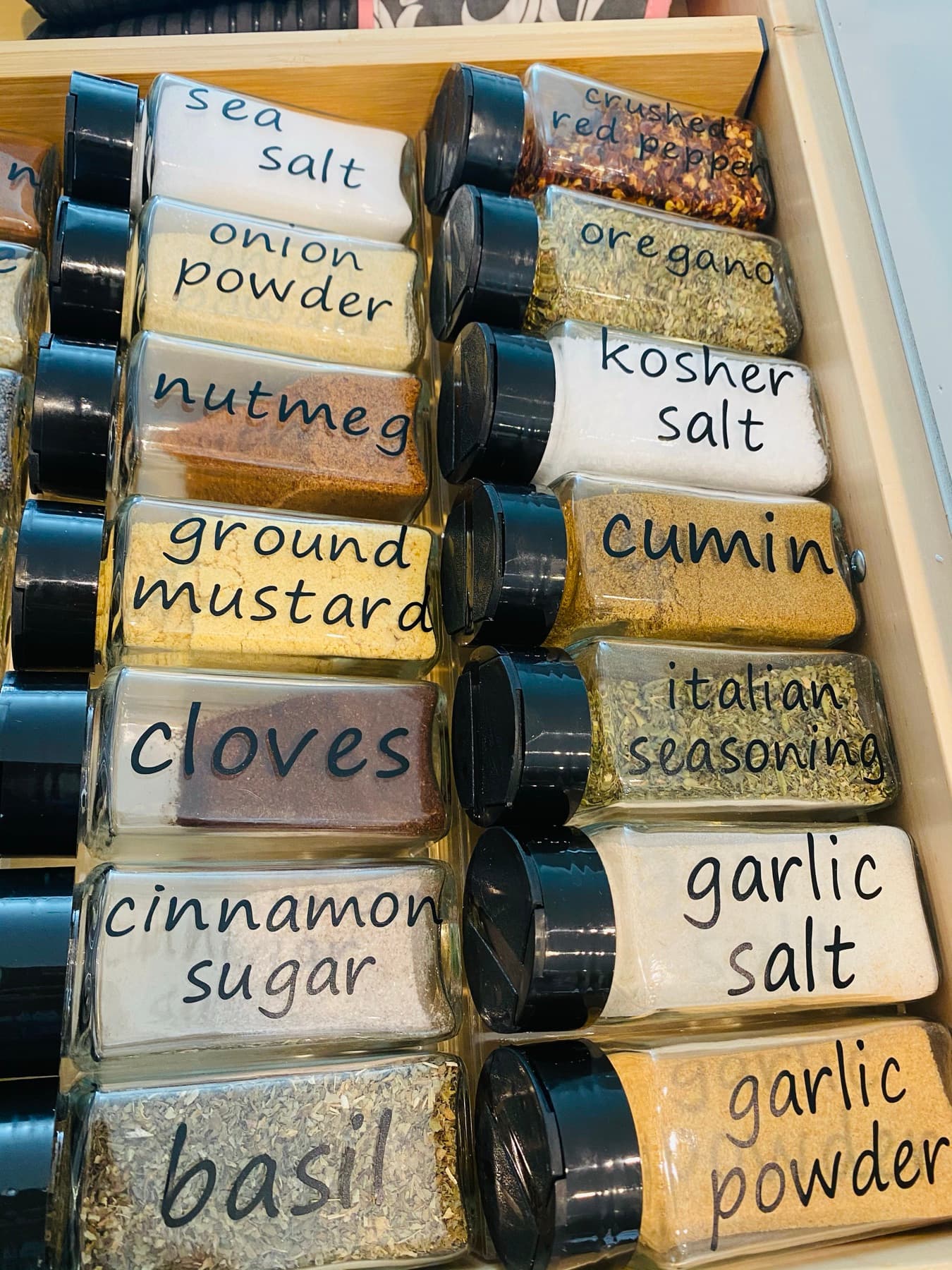 A labeled spice drawer, sorted and leveled.