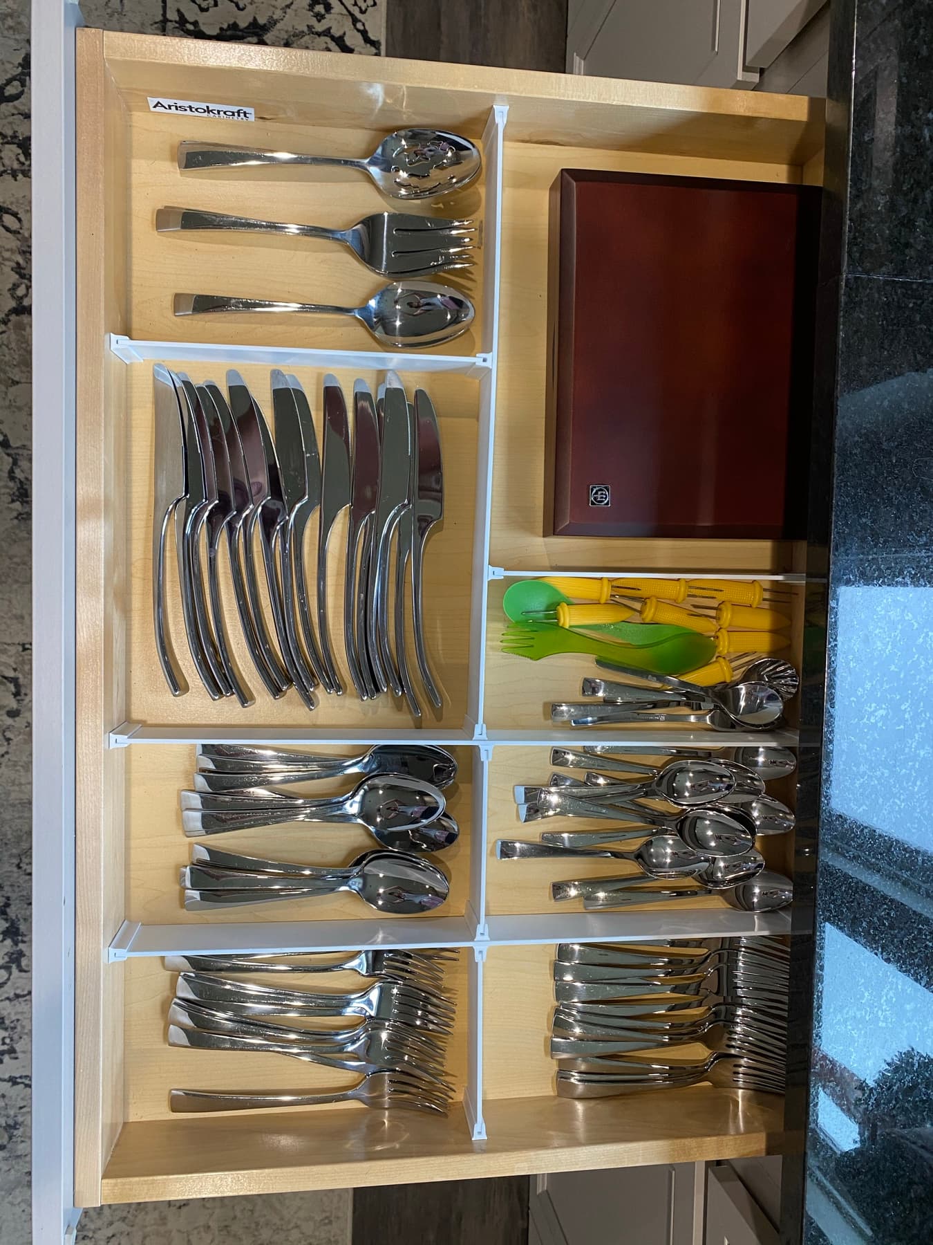 Drawer dividers keeping utensils in their lanes.