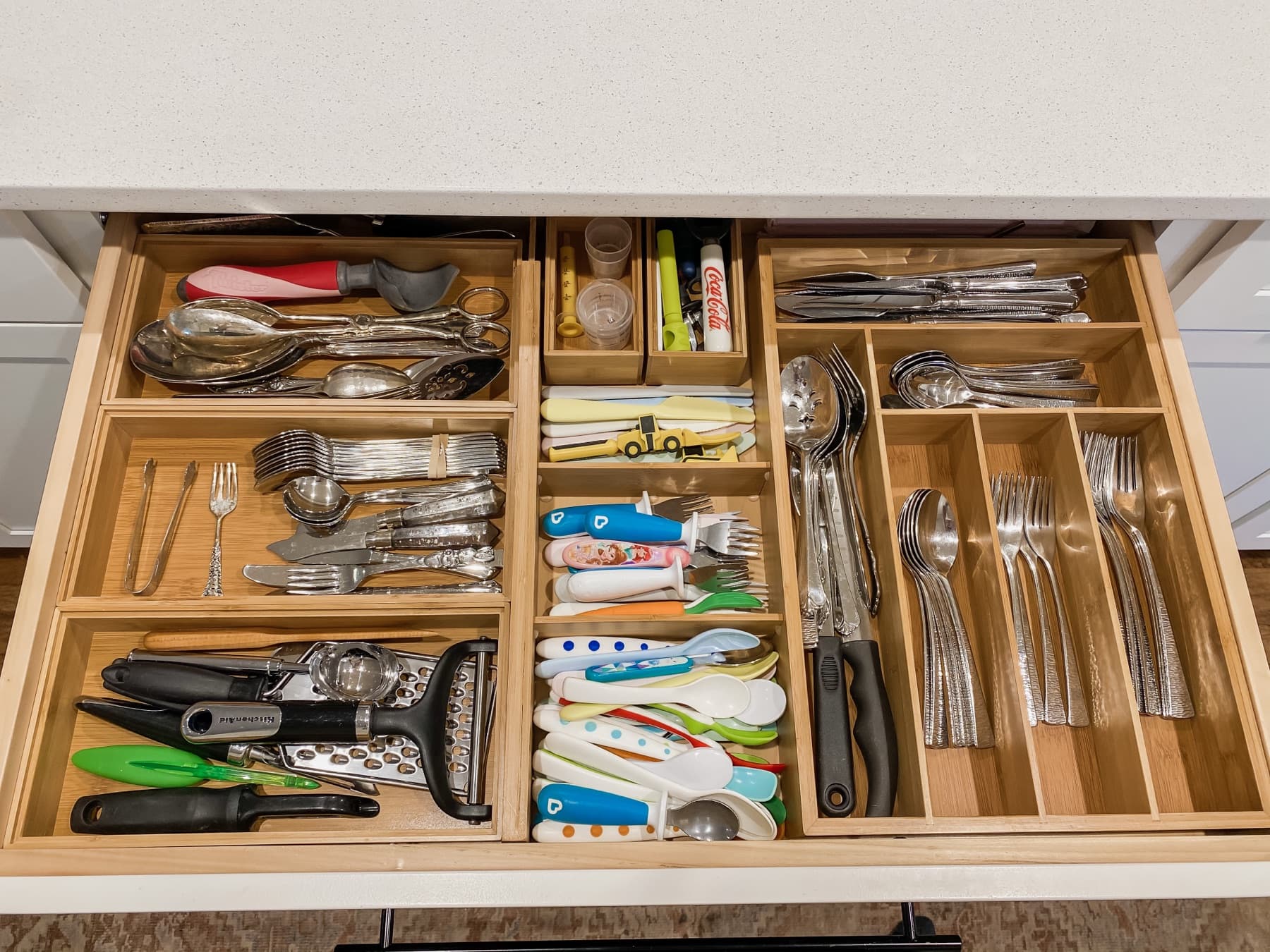 Labeled spice jars lined up by use.