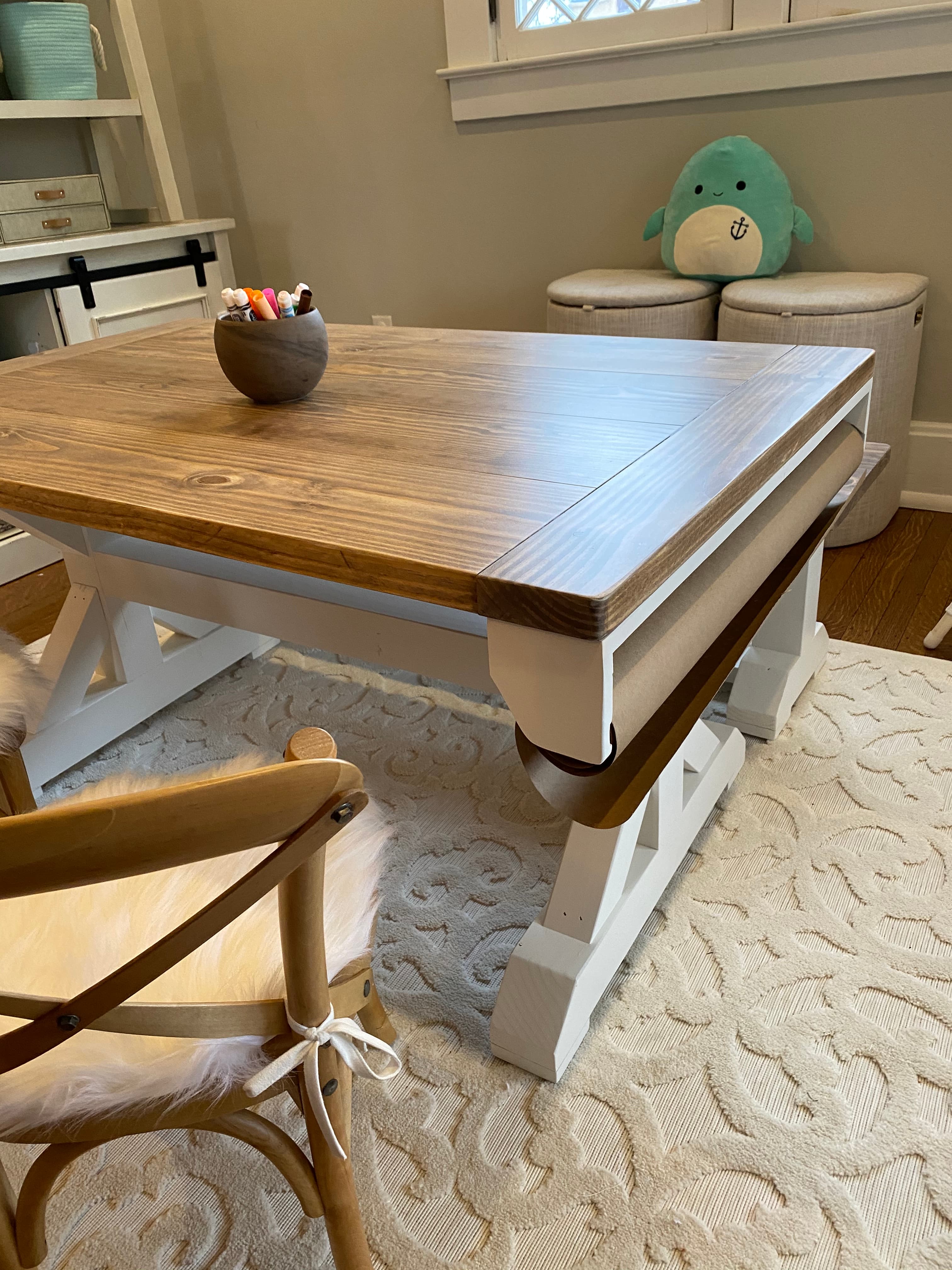 A closer look at the play table, crayon caddy in reach, the teepee nook just beyond.